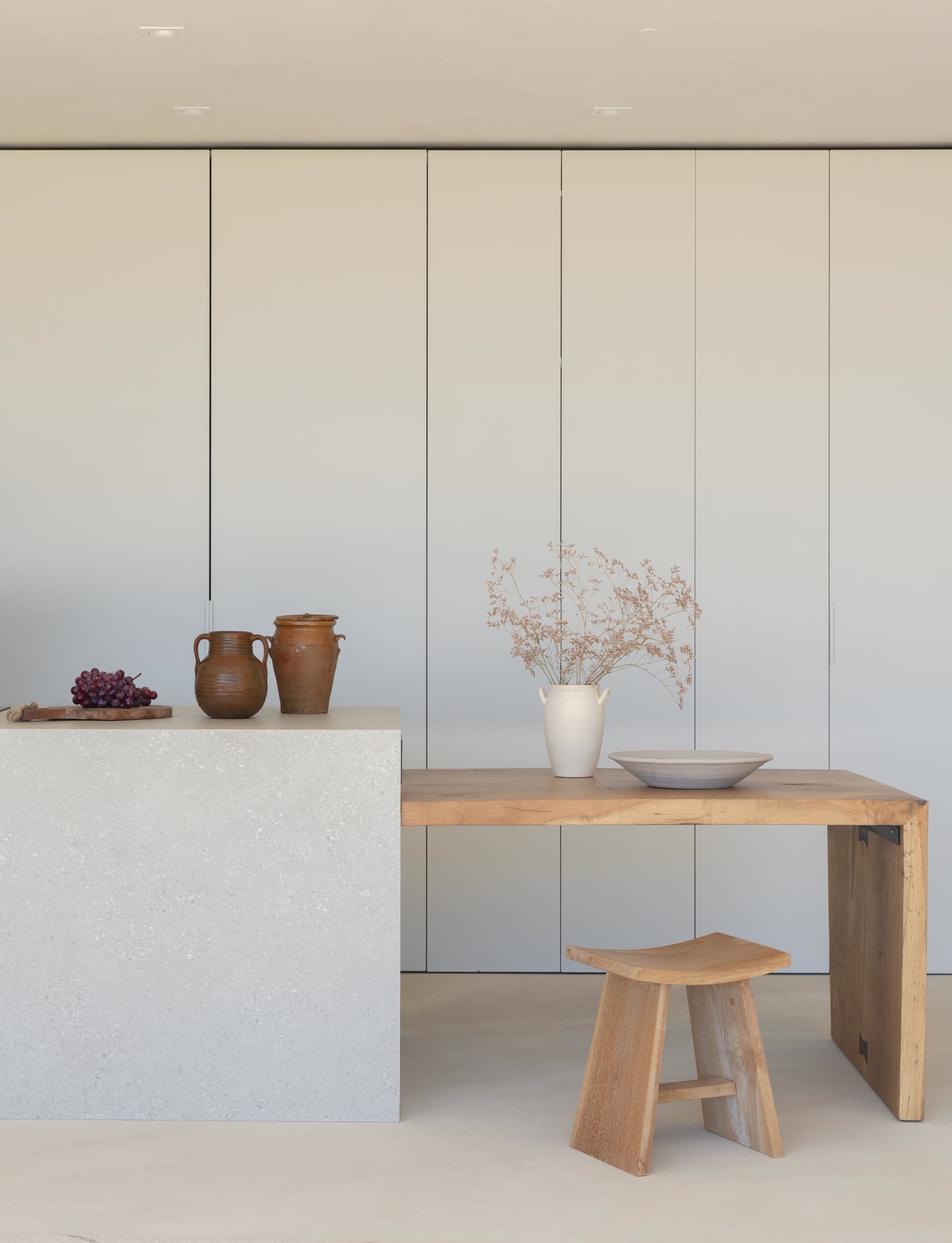 Kitchen in full-height cabinetry with solid-wood table by Marlot Baus