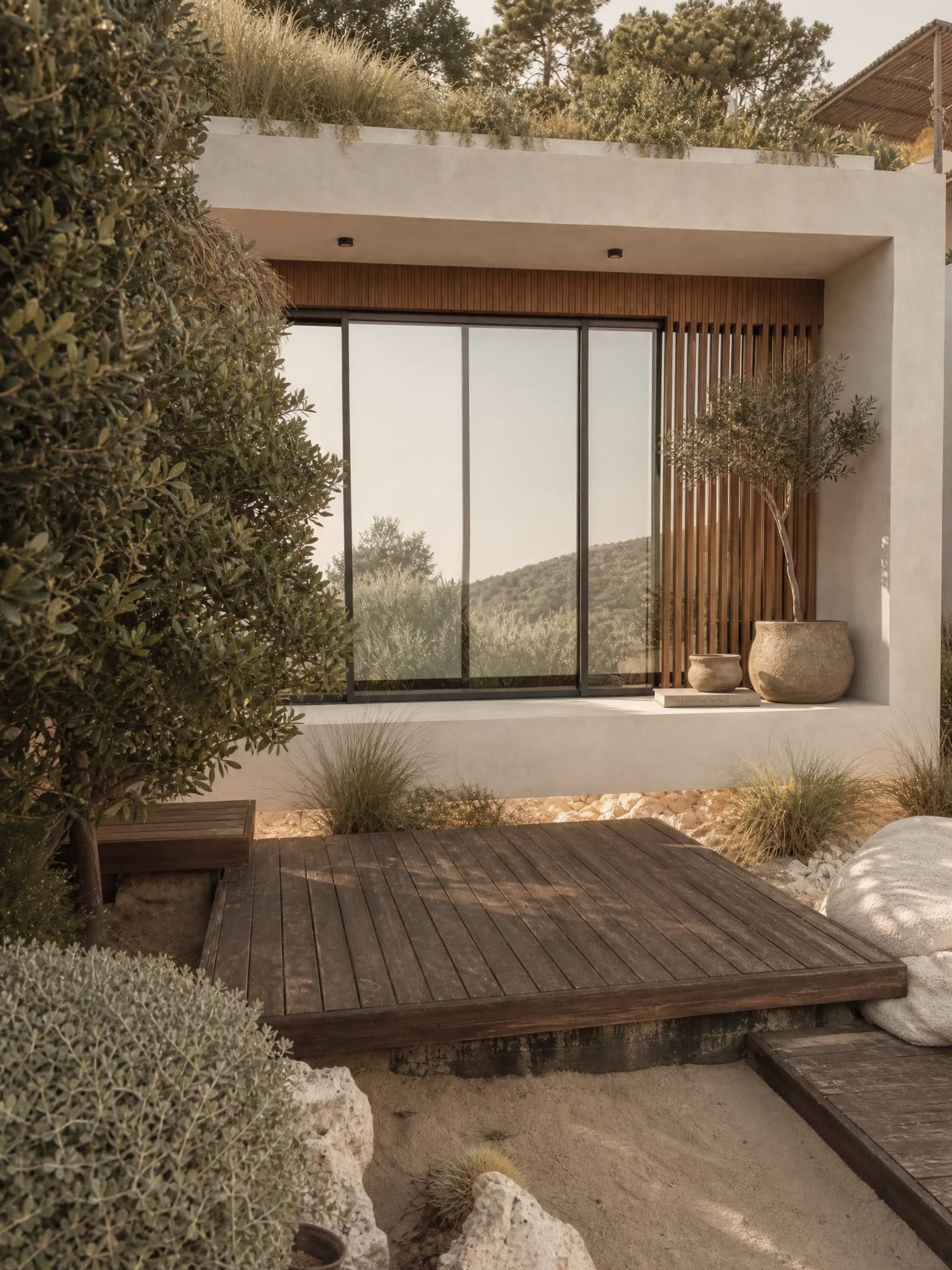The oak deck under the olive tree by the glazing