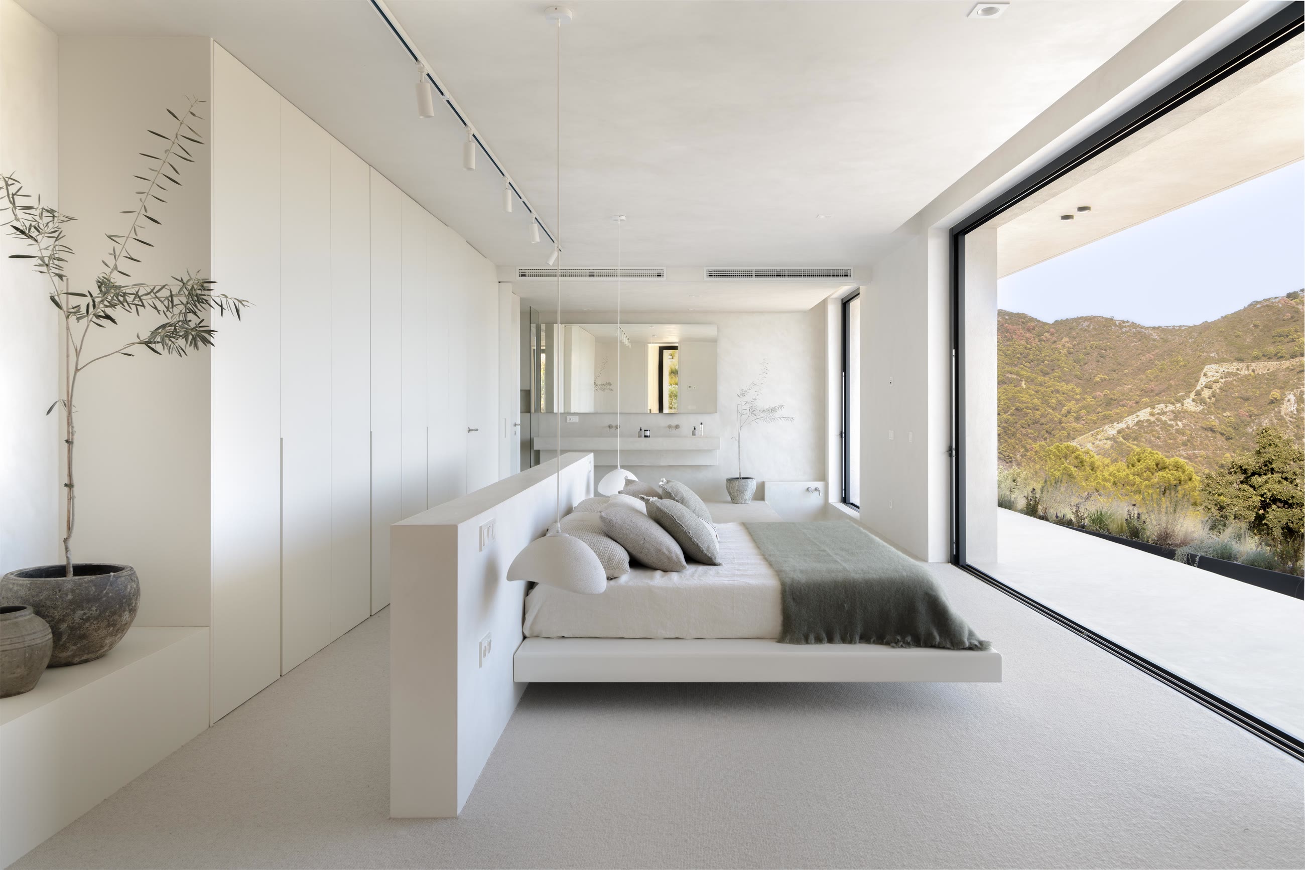 The 90 square metre main suite with corner glazing to the mountains